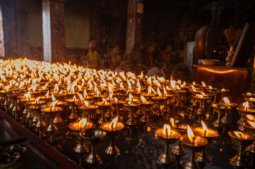 Light candles in Swayambhunath temple, Nepal. The faithful also light candles as a sign of gratitude to God for answered prayers.