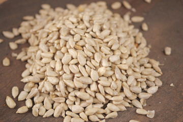 Sunflower seeds on a wooden surface in a close view