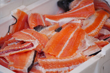 Fresh salmon fillets on display in a market