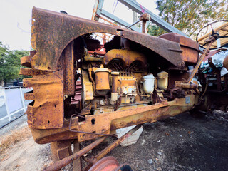 Old rusty vehicles in a vintage industrial setting