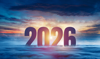 Silhouette of number 2026 on blue cloud, shiny design to celebrate happy new year. Mountain top and...