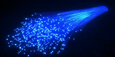 A cluster of bright blue fiber optic strands illuminates a dark background creating a vibrant glowing and futuristic light effect