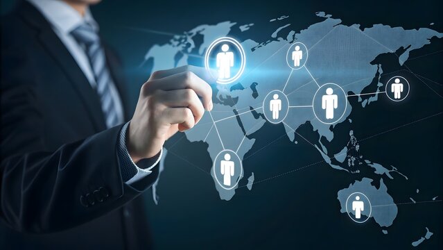 Businessman drawing a global network of human resources connections on a digital world map interface with glowing icons representing people and teamwork - Powered by Adobe