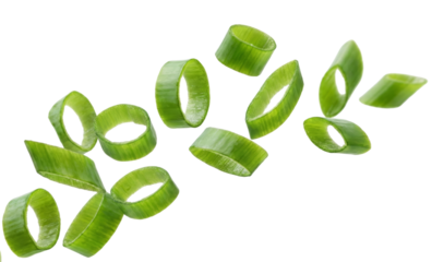 Vibrant green scallion slices artfully arranged in dynamic suspension isolated on a deep void
