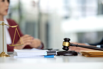 Lawyer consultant provides legal advice adult clients discuss documents scales of justice gavel symbol law office business meeting attorney