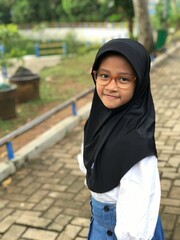 Portrait of a Hijabi Girl Wearing Glasses and Posing Naturally