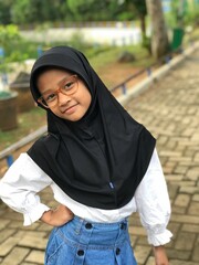 Portrait of a Hijabi Girl Wearing Glasses and Posing Naturally