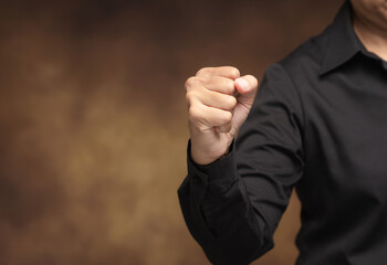 Clenched fist gesture symbolizing strength and determination.