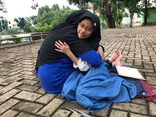 Mother and Daughter Sharing a Warm, Loving Hug