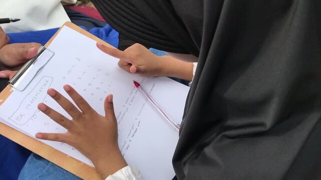 Mother and Child Learning Math Together Under Sunshine