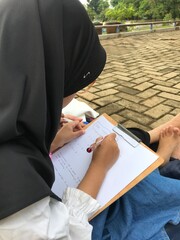 Mom Encouraging Her Daughter to Learn Outdoors