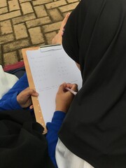 Happy Learning Session for Muslim Mom and Little Girl