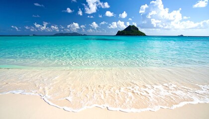 Turquoise ocean gently laps golden sand; blue sky and distant islands