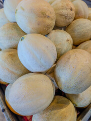 Pile of cantaloupe melons at local farmers market display