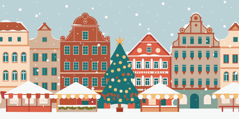 Charming european townscape with a christmas tree and falling snow