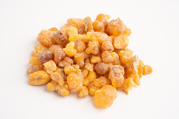 Frankincense or olibanum aromatic resin isolated on white background used in incense and perfumes.
