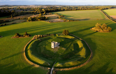 Church Henge. Part of Knowlton Rings Neolithic and Bronze Age earthworks, Dorset. 12th C Knowlton Church central. Great Barrow at 2 o&rsquo;clock. View to NE