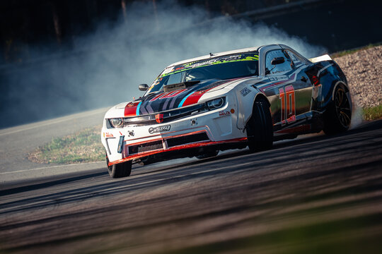 Latvia, Riga 03-05.10.2025. FIA Drifting cup High-speed racing car drifting on a track with smoke trailing behind