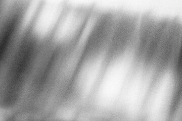 Obraz na płótnie Canvas Stippled grain texture background. Black sprayed dots gradient wallpaper. Rough noisy sand dotted backdrop.
