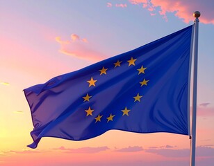 The flag of the european union, with its circle of stars, waving against a sunset whi 