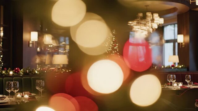 Elegant Christmas Restaurant Scene - A fancy restaurant is decorated for Christmas, with an elegant tree and beautifully set tables with wine glasses.