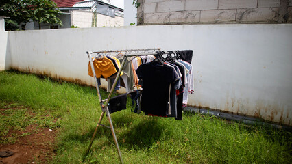 Clothes Drying on Outdoor Rack in Sunny Yard