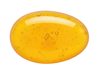 Close up of a golden honey drop with small bubbles transparent background cutout png