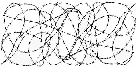 A tangled mass of black and white barbed wire creating a complex pattern