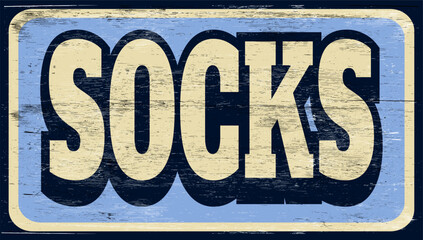 Aged and worn socks sign on wood