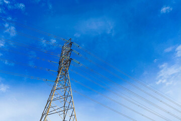Towering electric poles against the sky