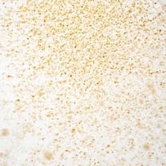Fine golden glitter particles suspended in air creating a festive and luxurious abstract background texture for celebration designs