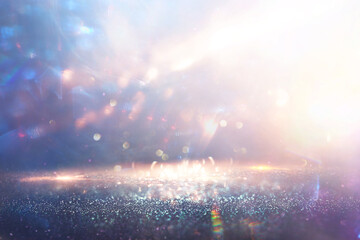 abstract glitter silver and gold lights background. de-focused