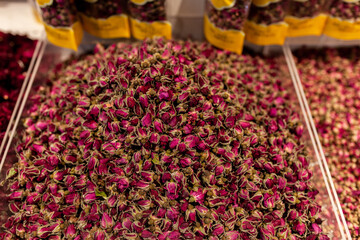 Close-up of vibrant pink dried rose buds tea piled in supermarket, Sanya, Hainan, China. Hainan&rsquo;s floral tea traditions and island market culture.