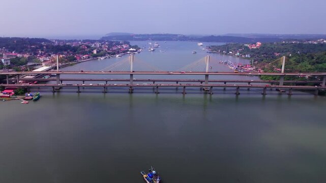 Aerial view of atal setu bridge with Mandovi River and Panaji city at goa, india. day time, push in shot, drone shot, 4k.