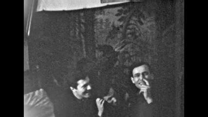 Men best friends actively chat, joke, argue playfully on home interior backdrop. Conscientious true friendship together. Excitement people in fun house happy party. Old film. Archival retro archive