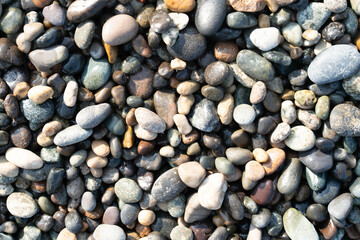 Walking along the shoreline, visitors can admire a stunning array of smooth stones, reflecting the colors of the sky and sea, enhancing the tranquil atmosphere of a spa getaway.