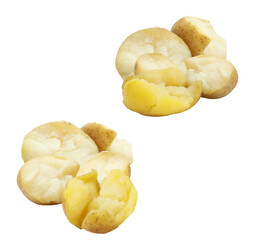 collection of freshly boiled whole and halved small yellow potatoes arranged in two separate rustic piles, ready for a meal.