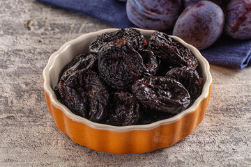 Black dry sweet prunes heap