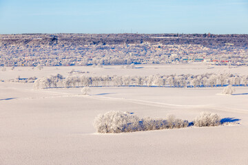 Aerial view at a city on a mountainside in wintry landscape at the swedish countryside