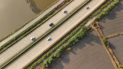 Aerial view of street in Bangkok Thailand with cars and countryside