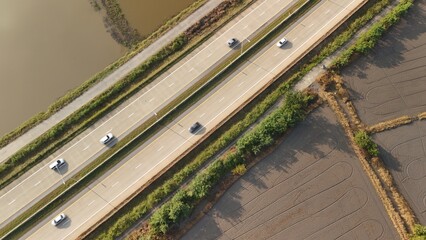 Aerial view of street in Bangkok Thailand with cars and countryside