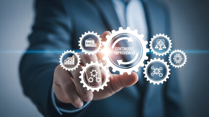 A person's finger points to a central gear graphic symbolizing continuous improvement with surrounding gears representing business concepts like finance growth and teamwork