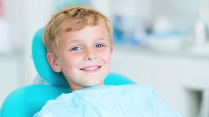Boy smiles while sitting in dental chair during routine check-up at clinic