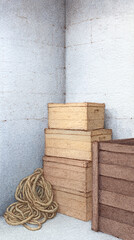 Exploring Simple Storage Solutions: Aesthetic Wooden Boxes and Decorative Rope in a Minimalist Corner Setting