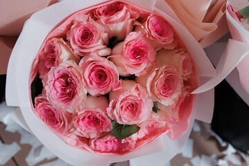 Beautiful bouquet of pink roses arranged with care for a special occasion or celebration in a bright setting