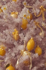 Christmas tree with lemon ornament and white flower