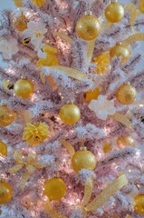 Christmas tree decorated with yellow ornaments