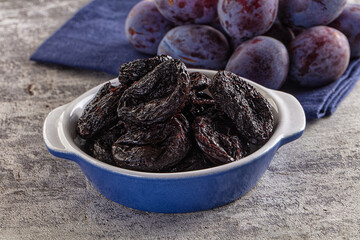 Black dry sweet prunes heap