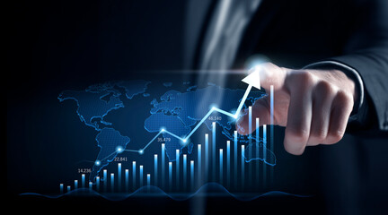 Businessman hand pointing at a futuristic digital interface with a bar chart showing financial growth, stock market success, and business progress.