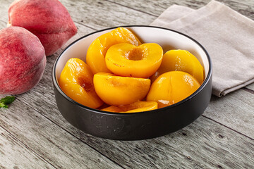 Sweet ripe yellow canned peaches